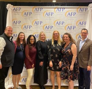 DHC's Malito and Weingartner with Clients at AFPLI Event